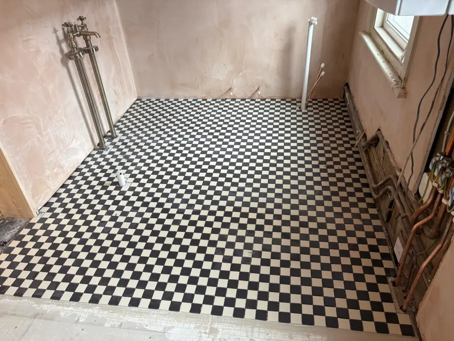 Black and cream checkerboard tile flooring