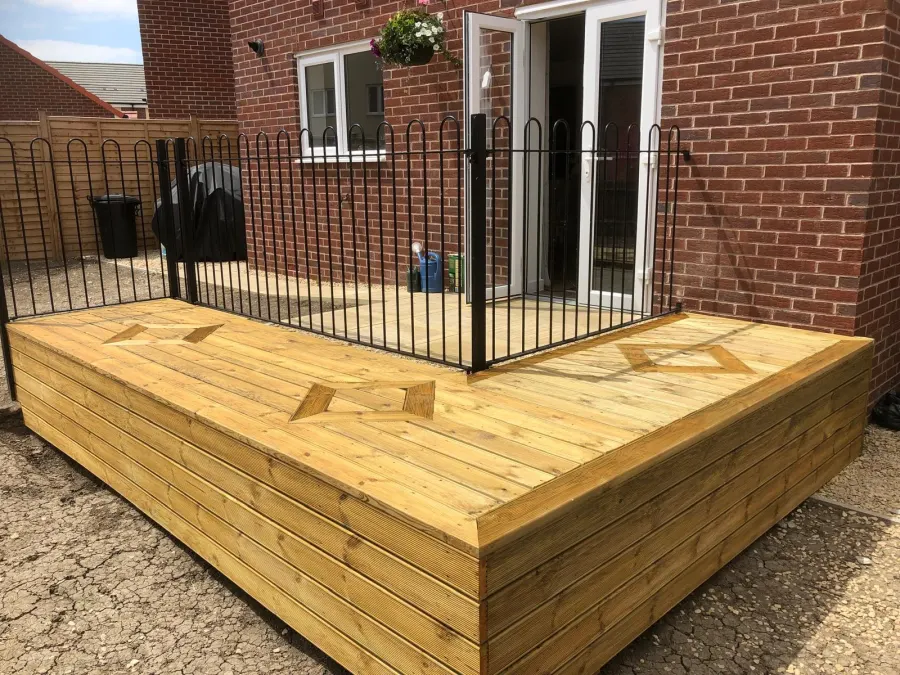Timber decking fitted against the house
