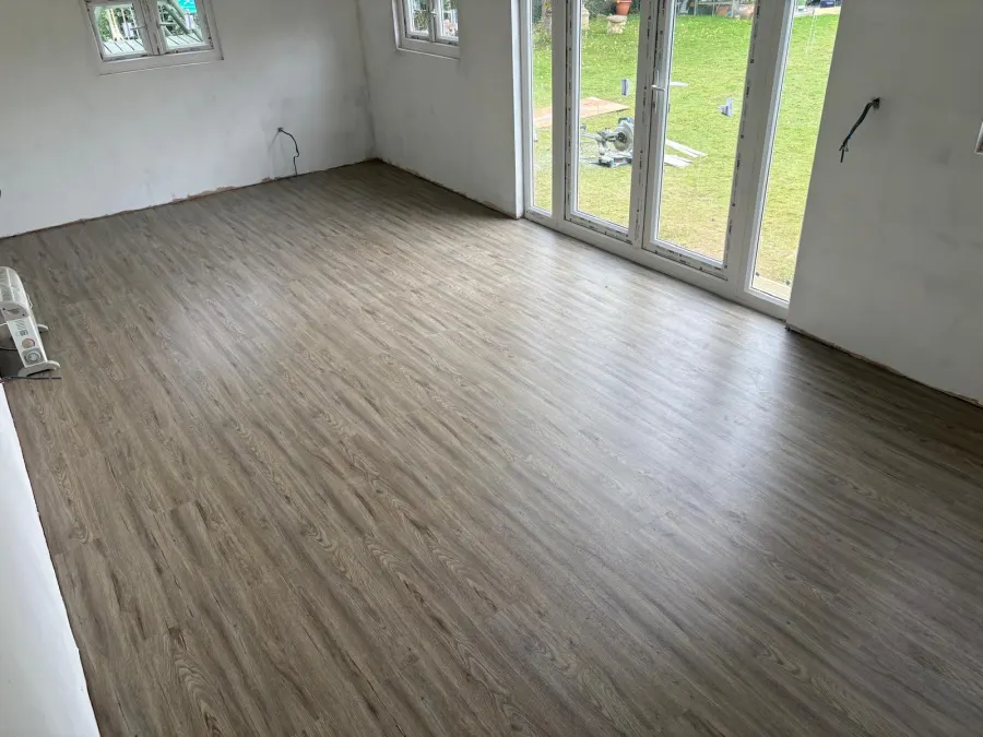 LVT flooring fitted in a room with bi-fold doors onto the garden