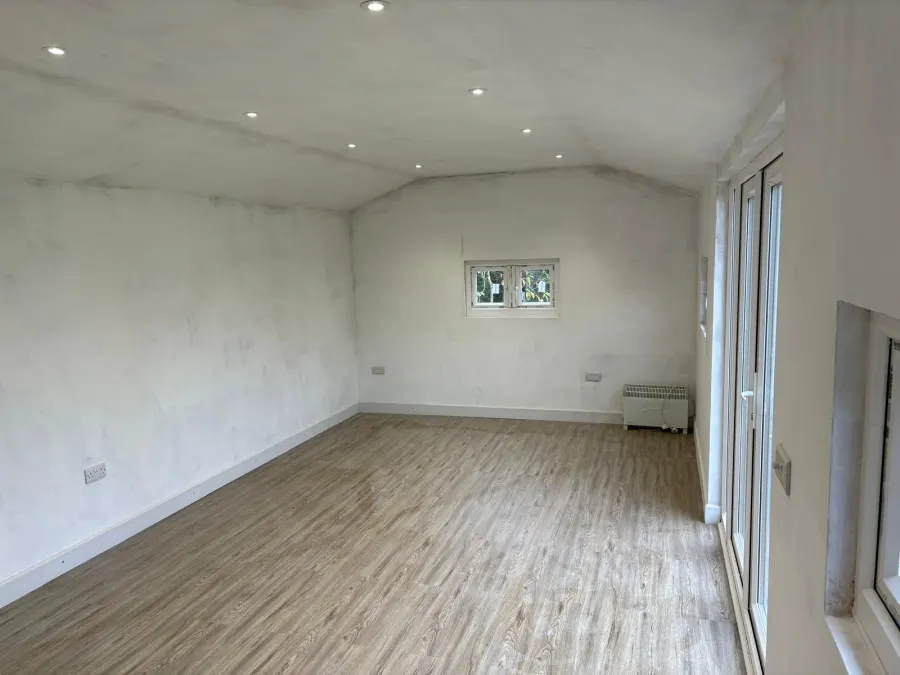 LVT flooring fitted in a garden room with vaulted ceiling