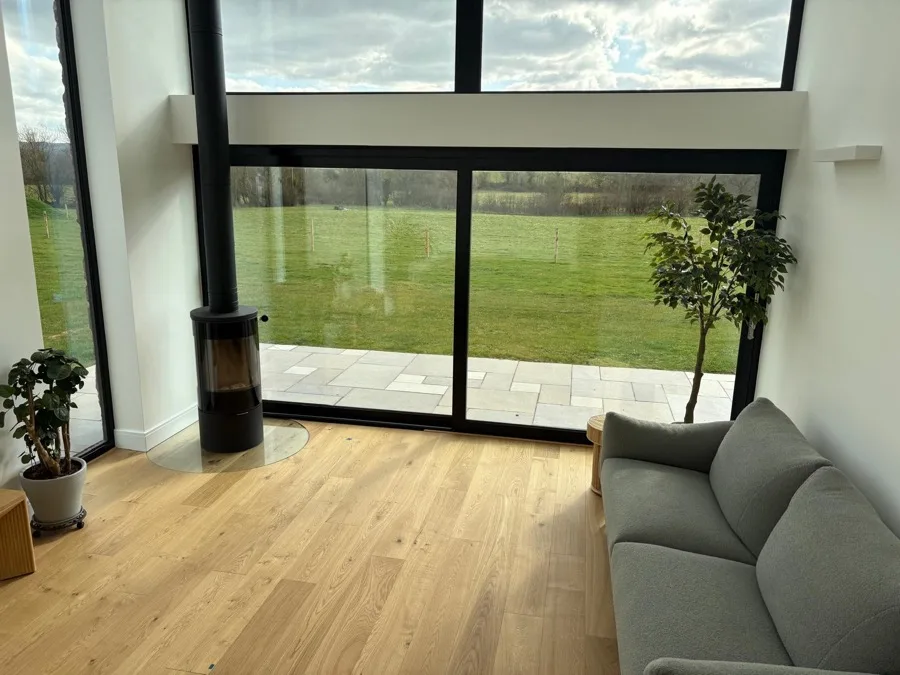 Solid oak flooring in a living room with countryside views