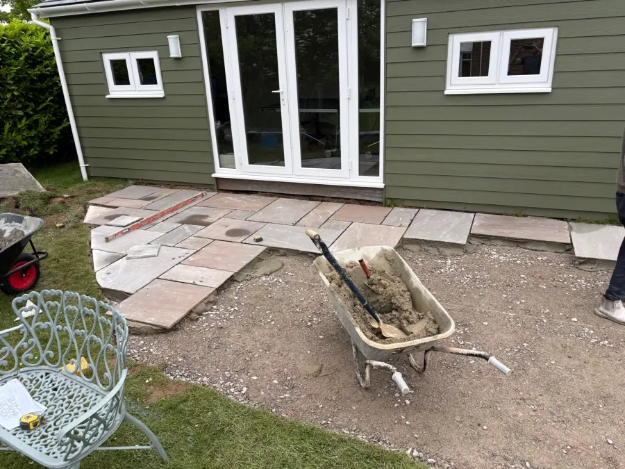 Laying the patio in front of a completed garden room