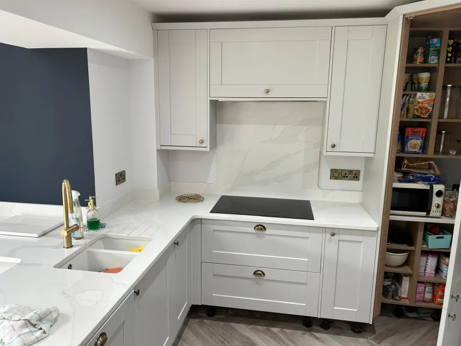 Granite kitchen island detail beneath a vaulted roof lantern